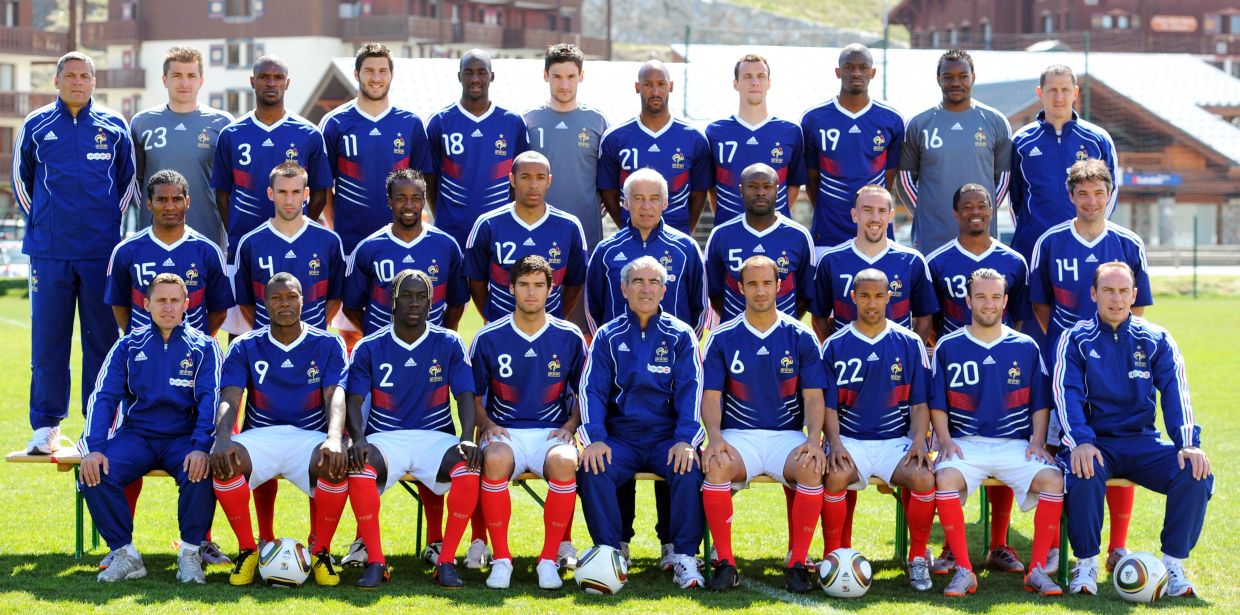 The French national football team and the technical staff pose prior to a training session on May 25, 2010 near Tignes in the French Alps, as part of the preparation for the upcoming World Cup 2010. France will play against Uruguay in Capetown in its group A opener match on June 11. (First row (up), LtoR, goalkeepers' coach Bruno Martini, goalkeeper Cedric Carasso, defender Eric Abidal, forward Andre-Pierre Gignac, midfielder Alou Diarra, goalkeeper Hugo Lloris, forward Nicolas Anelka, defender Sebastien Squillaci, midfielder Abou Diaby, goalkeeper Steve Mandanda and deputy goalkeepers' coach Fabrice Grange. Second row, LtoR, midfielder Florent Malouda, defender Anthony Reveillere, forward Sidney Govou, forward Thierry Henry, deputy coach Pierre Mankowski, defender William Gallas, midfielder Franck Ribery, defender Patrice Evra and midfielder Jeremy Toulalan. Third row, LtoR, Physical assistant Robert Duverne, forward Djibril Cisse, defender Bacary Sagna, midfielder Johan Gourcuff, coach Raymond Domenech, defender Marc Planus, defender Gael Clichy, forward Mathieu Valbuena and assistant coach Alain Boghossian. AFP PHOTO / FRANCK FIFE.
