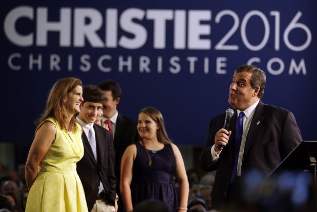 New Jersey Gov. Chris Christie stands with his wife, Mary Pat Christie, left, and their children, from left, Patrick, Sarah, Bridget and Andrew while speaking to supporters during an event announcing he will seek the Republican nomination for president, Tuesday, June 30, 2015, at Livingston High School in Livingston, N.J. (AP Photo/Mel Evans)