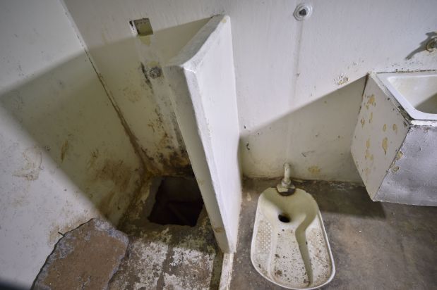 View of the hole (L) in the shower of the Almoloya prison where Joaquin Guzman Loera 