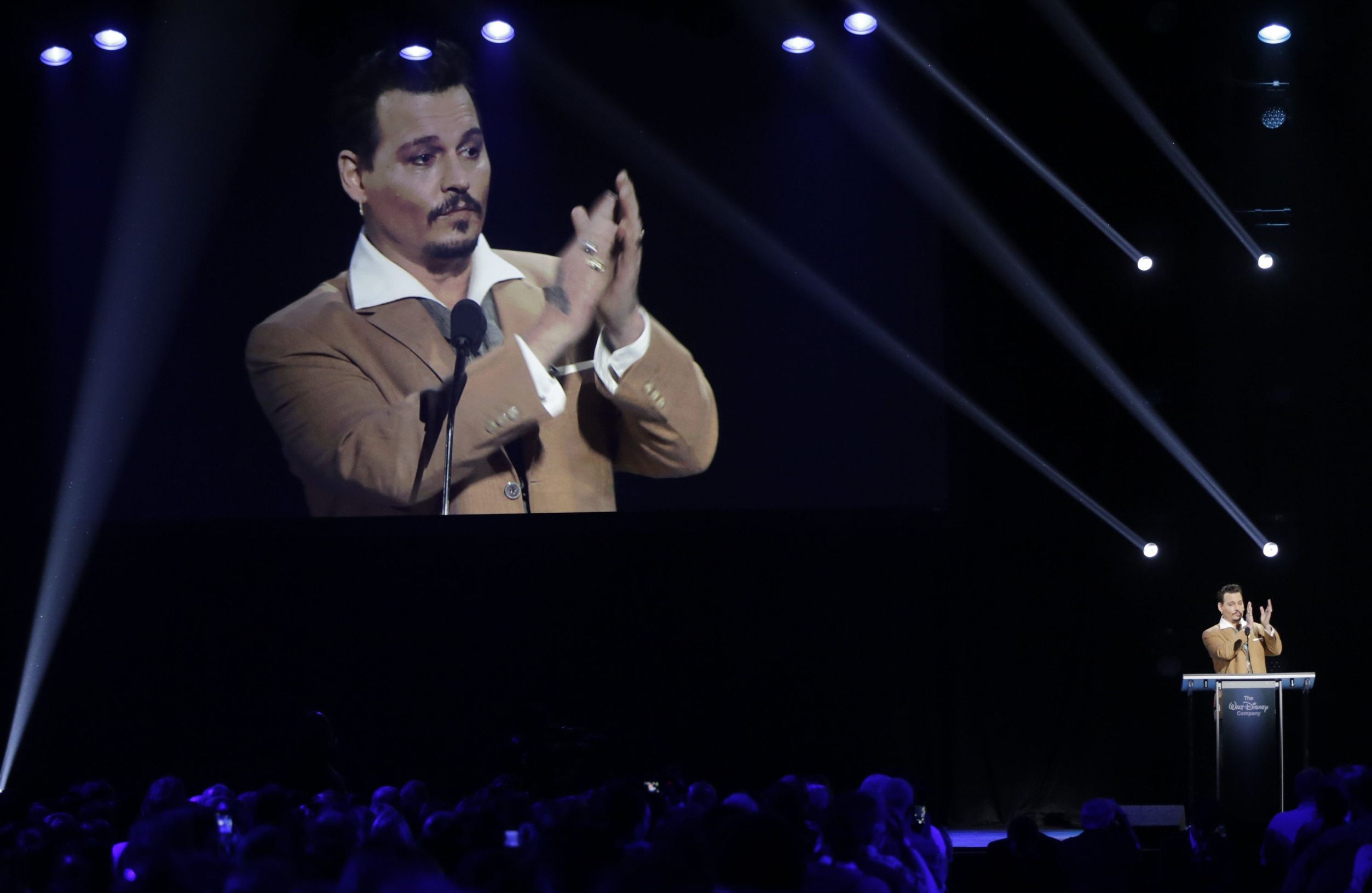 Actor Johnny Depp, thanks fans as he makes a surprise appearance at Disney's D23 Expo, a fan convention, to accept the Disney Legend honor , Friday, Aug. 14, 2015, in Anaheim, Calif. Depp has starred in Disney's