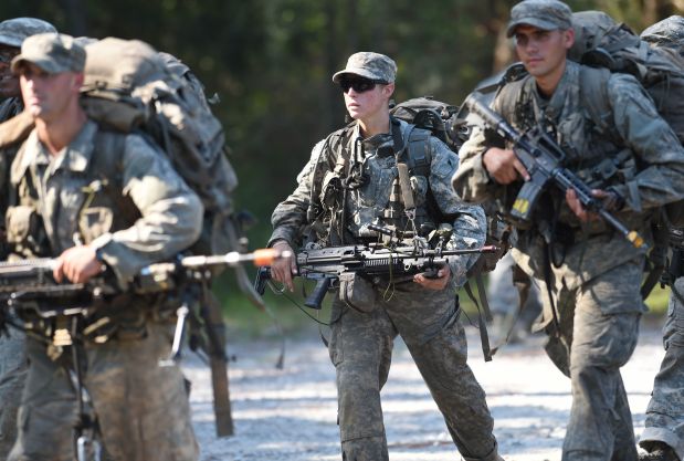 In this photo taken on Aug. 4, 2015, a female Army Ranger marches with her unit during Ranger School at Camp Rudder on Eglin Air Force Base, in Fla.  According to the Northwest Florida Daily News, she and one other female were the first to complete Ranger training and earn their Ranger tab this week. (Nick Tomecek/Northwest Florida Daily News via AP) MANDATORY CREDIT