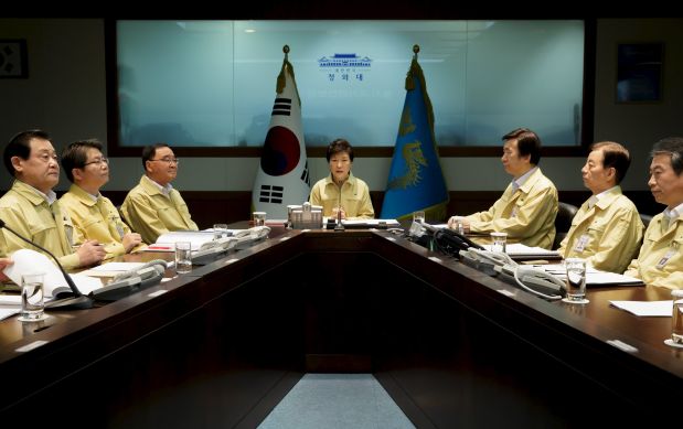South Korea's President Park Geun-hye (C) presides over a special National Security Council meeting at the Presidential Blue House in Seoul, South Korea, in this handout picture provided by the Presidential Blue House and released by News1 on August 20, 2015. North Korea warned of military action should South Korea continue anti-Pyongyang propaganda broadcasts along their shared border, the South's defense ministry said on Thursday, telling Seoul to halt the loudspeaker broadcasts within 48 hours.    REUTERS/the Presidential Blue House/News1 ATTENTION EDITORS - THIS IMAGE WAS PROVIDED BY A THIRD PARTY. THIS PICTURE IS DISTRIBUTED, EXACTLY AS RECEIVED BY REUTERS, AS A SERVICE TO CLIENTS. FOR EDITORIAL USE ONLY. NOT FOR SALE FOR MARKETING OR ADVERTISING CAMPAIGNS. NO SALES. SOUTH KOREA OUT. NO COMMERCIAL OR EDITORIAL SALES IN SOUTH KOREA.