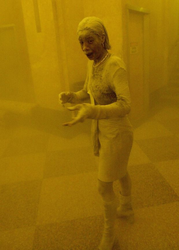 (FILES) This September 11, 2001 file photo shows Marcy Borders covered in dust as she takes refuge in an office building after one of the World Trade Center towers collapsed when commercial planes crashed into them in New York. Marcy Borders, a survivor of the September 11, 2001 attacks on New York who was featured in one of the most iconic photographs of the event, has died of stomach cancer on August 25, 2015. She was 42. After the attacks, Borders spiraled into a decade-long deep depression and alcohol and drug abuse, though she eventually recovered after several years.  AFP PHOTO / Stan HONDA/FILES