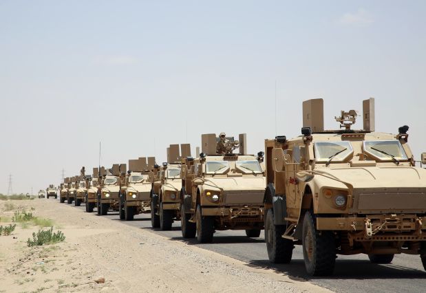 Pro-government forces loyal to Yemen's exiled President Abedrabbo Mansour Hadi drive armored vehicles in Marib province, east of the capital, Sanaa, on September 8, 2015. Gulf Arab monarchies have sent thousands of heavily armed troops to reinforce loyalists in Yemen in the battle against Iran-backed rebels a media reported earlier this week. AFP PHOTO / ABDULLAH HASSAN