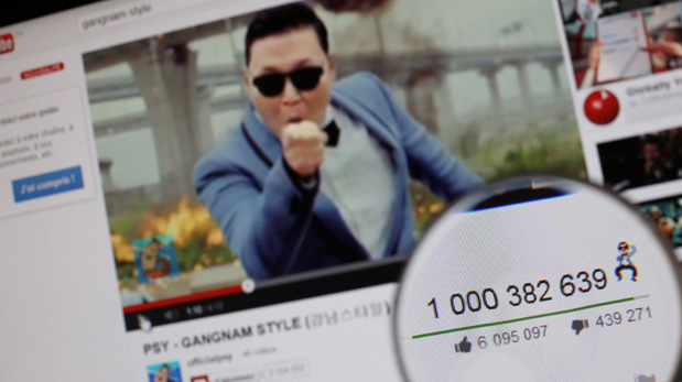 A magnifying glass shows the number of times that viewers have watched South Korean rapper Psy's video Gangnam style on YouTube on December 21, 2012. Psy's 
