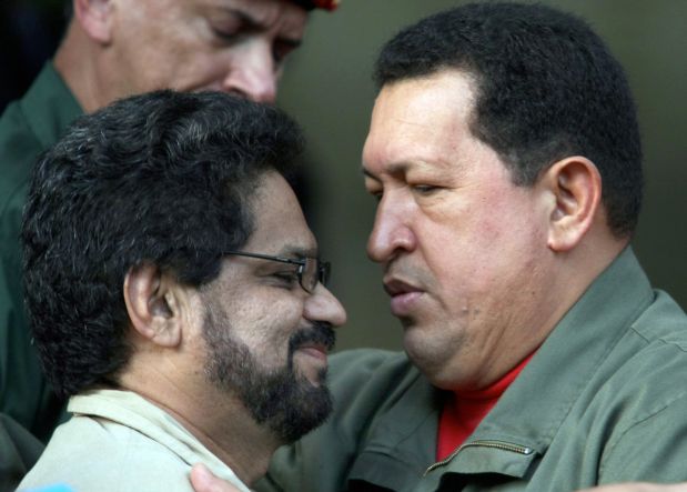 Venezuelan President Hugo Chavez (R) talks with Colombian FARC guerrillas' representative, commander Ivan Marquez, 08 November, 2007 during a press conference at the Miraflores presidential palace in Caracas. Chavez said on Thursday that he aspires to take to his meeting with French President Nicolas Sarkozy on November 20th in Paris proof that Ingrid Betancourt is still alive. AFP PHOTO/Juan BARRETO