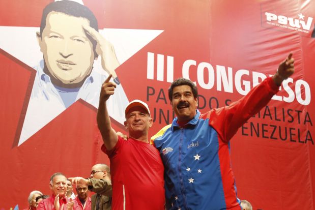 Venezuela's President Nicolas Maduro (R) embraces retired General Hugo Carvajal as they attend the Socialist party congress in Caracas in this picture provided by Miraflores Palace July 27, 2014. The former Venezuelan military intelligence head detained on the Caribbean island of Aruba over U.S accusations of drug-trafficking was released and flew home on Sunday. Instead of being extradited to the United States, retired General Hugo Carvajal flew home after the Netherlands government ruled he had diplomatic immunity, his lawyer and Venezuelan officials said.Carvajal, who ran military intelligence from 2004 to 2008 during the presidency of the late Hugo Chavez, was arrested on Wednesday after flying to the semi-autonomous island that is part of the kingdom of the Netherlands.REUTERS/Miraflores Palace/Handout via Reuters (VENEZUELA - Tags: POLITICS) ATTENTION EDITORS - THIS PICTURE WAS PROVIDED BY A THIRD PARTY. REUTERS IS UNABLE TO INDEPENDENTLY VERIFY THE AUTHENTICITY, CONTENT, LOCATION OR DATE OF THIS IMAGE. FOR EDITORIAL USE ONLY. NOT FOR SALE FOR MARKETING OR ADVERTISING CAMPAIGNS. THIS PICTURE IS DISTRIBUTED EXACTLY AS RECEIVED BY REUTERS, AS A SERVICE TO CLIENTS