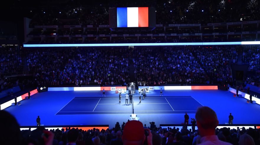 Tennis - Barclays ATP World Tour Finals - O2 Arena, London - 15/11/15Men's Singles - General view of Japan's Kei Nishikori and Serbia's Novak Djokovic, spectators and officials during a minute silence in memory of the Paris attacksReuters / Toby MelvilleLivepicEDITORIAL USE ONLY.