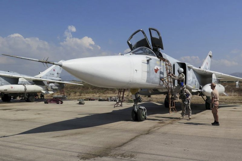 Pilots of a Russian Sukhoi Su-24 fighter jet prepare before a flight at the Hmeymim air base near Latakia, Syria, in this handout photograph released by Russia's Defence Ministry October 5, 2015. Turkish fighter jets shot down a Russian-made warplane near the Syrian border on November 24, 2015 after repeatedly warning it over air space violations, Turkish officials said, but Moscow said it could prove the jet had not left Syrian air space.  REUTERS/Ministry of Defence of the Russian Federation/Handout via Reuters ATTENTION EDITORS - THIS PICTURE WAS PROVIDED BY A THIRD PARTY. REUTERS IS UNABLE TO INDEPENDENTLY VERIFY THE AUTHENTICITY, CONTENT, LOCATION OR DATE OF THIS IMAGE. THIS PICTURE IS DISTRIBUTED EXACTLY AS RECEIVED BY REUTERS, AS A SERVICE TO CLIENTS. EDITORIAL USE ONLY. NOT FOR SALE FOR MARKETING OR ADVERTISING CAMPAIGNS. NO RESALES. NO ARCHIVE.