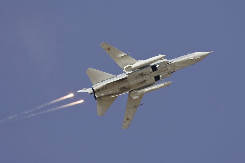 A Sukhoi Su-24 jet fighter drops flares during a joint Kazakh-Russian military exercise at Otar military range, west of Almaty, in this October 3, 2008 file picture. A warplane shot down by Turkey near the Syrian border on November 24, 2015 was a Russian-made SU-24, Turkish presidential sources said, adding it was downed in line with Turkey's rules of engagement after violating Ankara's airspace. Russia's defence ministry said the downed fighter jet was Russian and did not violate Turkish airspace, the RIA news agency reported. REUTERS/Shamil Zhumatov/Files