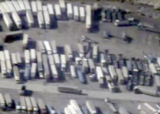 An undated still image taken from a video made available by the Russian Defence Ministry in Moscow, Russia December 2, 2015, shows the Turkish-Syrian border crossing. Russia's defence ministry officials displayed satellite images on Wednesday which they said showed columns of tanker trucks loading with oil at installations controlled by Islamic State in Syria and Iraq, and then crossing the border into neighbouring Turkey.       REUTERS/Russian Defence Ministry/Handout via Reuters   ATTENTION EDITORS - THIS PICTURE WAS PROVIDED BY A THIRD PARTY. REUTERS IS UNABLE TO INDEPENDENTLY VERIFY THE AUTHENTICITY, CONTENT, LOCATION OR DATE OF THIS IMAGE. FOR EDITORIAL USE ONLY. NOT FOR SALE FOR MARKETING OR ADVERTISING CAMPAIGNS. FOR EDITORIAL USE ONLY. NO RESALES. NO ARCHIVE. THIS PICTURE IS DISTRIBUTED EXACTLY AS RECEIVED BY REUTERS, AS A SERVICE TO CLIENTS.