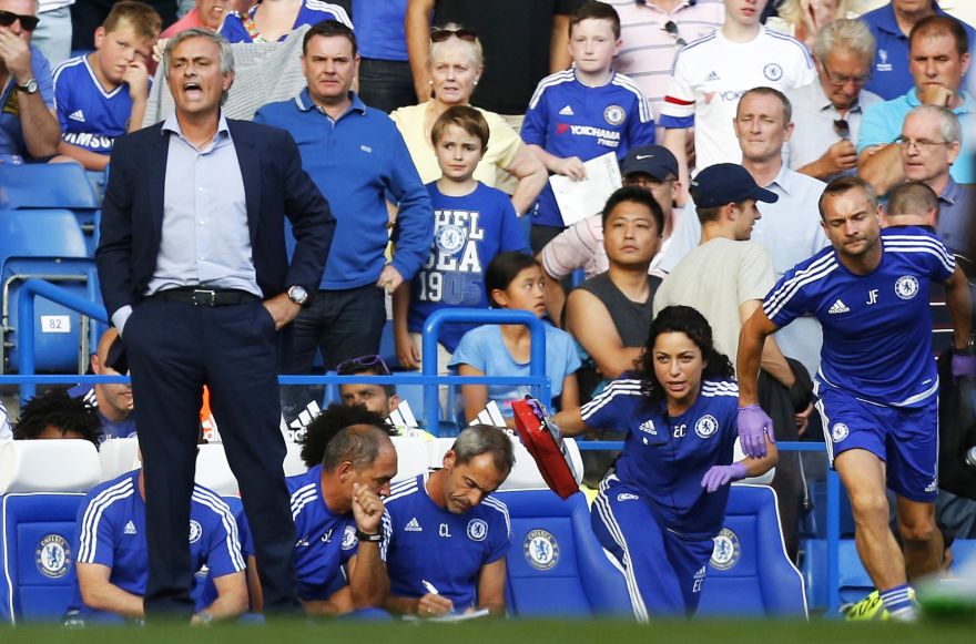 (FILES) In a file picture taken on August 8, 2015 Chelsea doctor (2R) Eva Carneiro and head physio Jon Fearn (R) leave the bench to treat Chelsea's Belgian midfielder Eden Hazard late in the game as Chelsea's Portuguese manager Jose Mourinho (L) gestures during the English Premier League football match between Chelsea and Swansea City  at Stamford Bridge in London. Chelsea manager Jose Mourinho has been sacked after a disastrous start to the Premier League season on December 17, 2015.AFP PHOTO / IAN KINGTONRESTRICTED TO EDITORIAL USE. No use with unauthorized audio, video, data, fixture lists, club/league logos or 'live' services. Online in-match use limited to 75 images, no video emulation. No use in betting, games or single club/league/player publications.