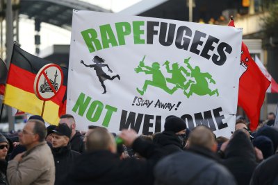 Supporters of anti-immigration right-wing movement PEGIDA (Patriotic Europeans Against the Islamisation of the West) take part in in demonstration rally, in reaction to mass assaults on women on New Year's Eve, in Cologne, Germany, January 9, 2016.   REUTERS/Wolfgang Rattay
