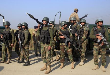 Soldiers gather outside Bacha Khan University where an attack by militants took place, in Charsadda, Pakistan, January 20, 2016. REUTERS/Fayaz Aziz