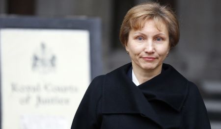 Marina Litvinenko, widow of former Russian spy Alexander Litvinenko, reads a statement outside the Royal Courts of Justice in London, Thursday, Jan. 21, 2016.President Vladimir Putin probably approved a plan by Russia's FSB security service to kill former agent Alexander Litvinenko, a British judge said Thursday. (AP Photo/Frank Augstein)