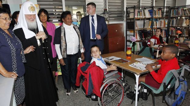 Russian Orthodox Patriarch Kirill visits the Panama Solidarity School for students with special needs in Havana, Cuba, Saturday, Feb. 13, 2016. Kirill is on an four-day official visit to Cuba. (Ernesto Mastrascusa/Pool Photo via AP)