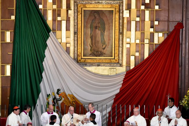 Pope Francis celebrates Holy Mass in the Basilica of Our Lady of Guadalupe in Mexico City on February 13, 2016. Pope Francis is in Mexico for a trip encompassing two of the defining themes of his papacy: bridge-building diplomacy and his concern for migrants seeking a better life.   AFP PHOTO / GABRIEL BOUYS