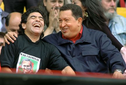 Venezuelan President Hugo Chavez (R) jokes with Argentinian former soccer star Diego Armando Maradona during the 