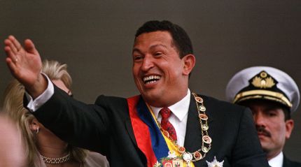 FILE--New Venezuelan President Hugo Chavez salutes troops during a military parade beside in Caracas, Venezuela, Thursday, in this February 4, 1999 file photo. Chavez, who was sworn in Feb. 2, 1999, presided over the military parade in his honor, which coincides with the seventh anniversary of the failed military coup which he led.  At left is first lady Marisabel.  (AP Photo/Jose Caruci)OPSE 2004MAR20 HUGO CHAVEZ DESFILE MILITAR VENEZUELA2004MAR20 AFD
