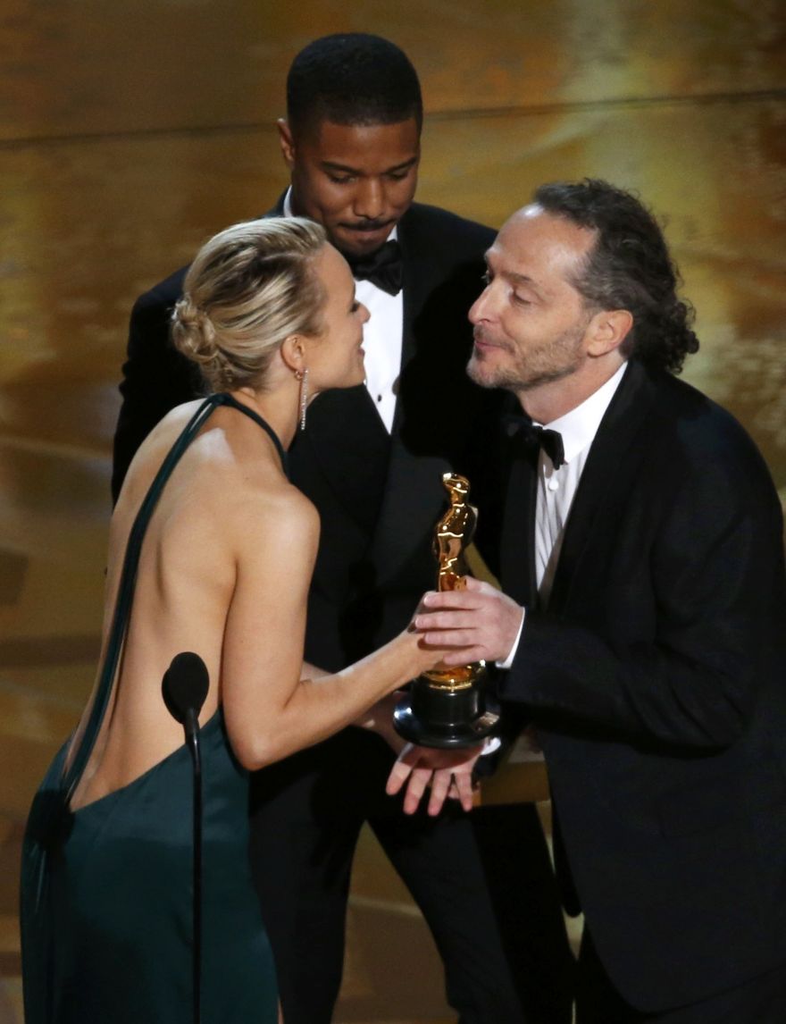 Michael B. Jordan and Rachel McAdams (L) present Emmanuel Lubezki (R) the Oscar for Best Cinematography for the movie 