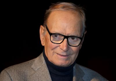 FILE - In this Dec. 6, 2013 file photo, composer Ennio Morricone appears at a photo call to promote his German 2014 concerts, in Berlin, Germany. Morricone won a Golden Globe award on Jan. 10, 2016 for composing the score for 