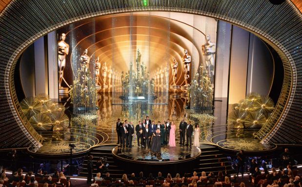Members of the cast and producers of Spotlight accept the award for Best Picture at the 88th Oscars on February 28, 2016 in Hollywood, California. AFP PHOTO / MARK RALSTON