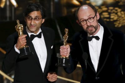 Asif Kapadia (L) and James Gay-Rees accept the Oscar for the Best Documentary Feature for their movie 