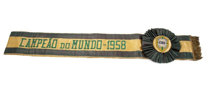 A yellow and green satin sash with a gold bullion fringe presented to Pele by the Brazilian Sport Confederation (CBD) to commemorate Brazil's legendary 1958 FIFA World Cup victory is shown in this handout photo released on March 8, 2016. Triple World Cup soccer winner Pele is putting some 2,000 items up for auction, including his three World Cup medals and a one of a kind Jules Rimet trophy that could fetch up to one million dollars, auctioneers said on March 10, 2016.  REUTERS/Julien's Auctions/Handout via Reuters   ATTENTION EDITORS - THIS PICTURE WAS PROVIDED BY A THIRD PARTY. REUTERS IS UNABLE TO INDEPENDENTLY VERIFY THE AUTHENTICITY, CONTENT, LOCATION OR DATE OF THIS IMAGE. FOR EDITORIAL USE ONLY. NOT FOR SALE FOR MARKETING OR ADVERTISING CAMPAIGNS. FOR EDITORIAL USE ONLY. NO RESALES. NO ARCHIVE. THIS PICTURE IS DISTRIBUTED EXACTLY AS RECEIVED BY REUTERS, AS A SERVICE TO CLIENTS.