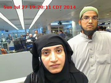 This July 27, 2014, file photo provided by U.S. Customs and Border Protection shows Tashfeen Malik, left, and Syed Farook, as they passed through O'Hare International Airport in Chicago. The husband and wife died on Dec. 2, 2015, in a gun battle with authorities several hours after their assault on a gathering of Farook's colleagues in San Bernardino, Calif. The prosecutor's office says information contained in an encrypted iPhone could help finally answer whether there was a third assailant in the San Bernardino terror attack that killed 14 people.The district attorney's brief is among many weighing in on the fight between Apple and the federal government over unlocking the county-owned iPhone used by shooter Syed Farook. (U.S. Customs and Border Protection via AP, File)