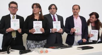 Alejandro Valencia, left, Angela Buitrago, second left, Francisco Cox, center, Carlos Beritain, second right, and Claudia Paz, of the international experts group hold copies of their final report in the disappearance of 43 students, in Mexico City, Sunday, April 24, 2016. The report says there is evidence that Mexican police tortured some of the key suspects arrested in the disappearance of the students. The 43 students have not been heard from since they were taken by local police in September 2014 in the city of Iguala, Guerrero state. (AP Photo/Marco Ugarte)
