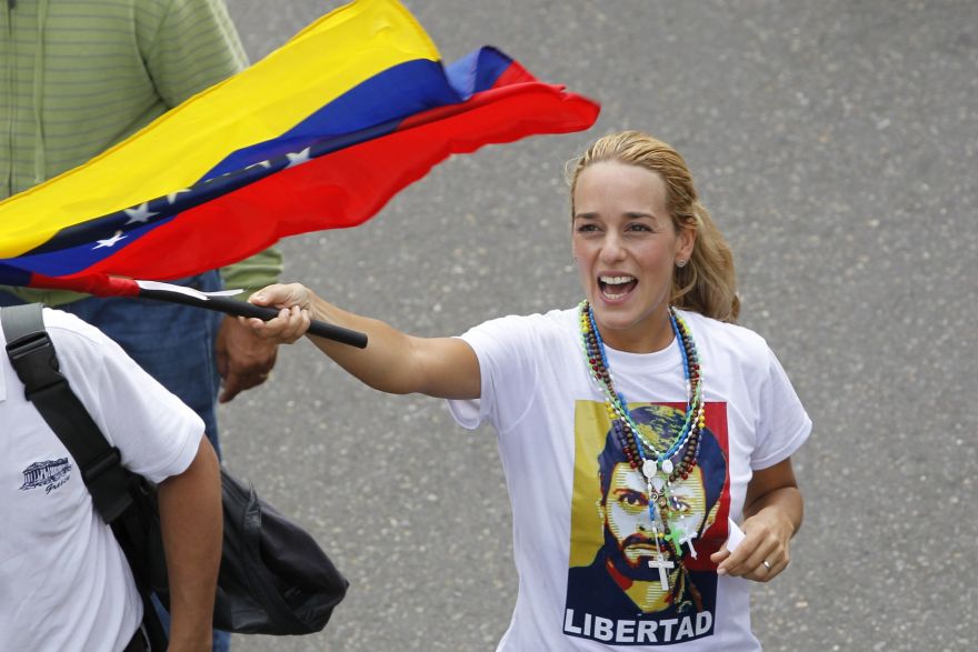 Lilian Tintori, wife of jailed opposition leader Leopoldo Lopez, march during anti-government protest against education reforms in Caracas April 26, 2014. Venezuelan justice determined on Friday that Venezuelans who want peaceful protest must request permission from local governments to prevent the scattered forces, amid a wave of violent protests against President Nicolas Maduro. REUTERS/Christian Veron (VENEZUELA - Tags: POLITICS CIVIL UNREST)