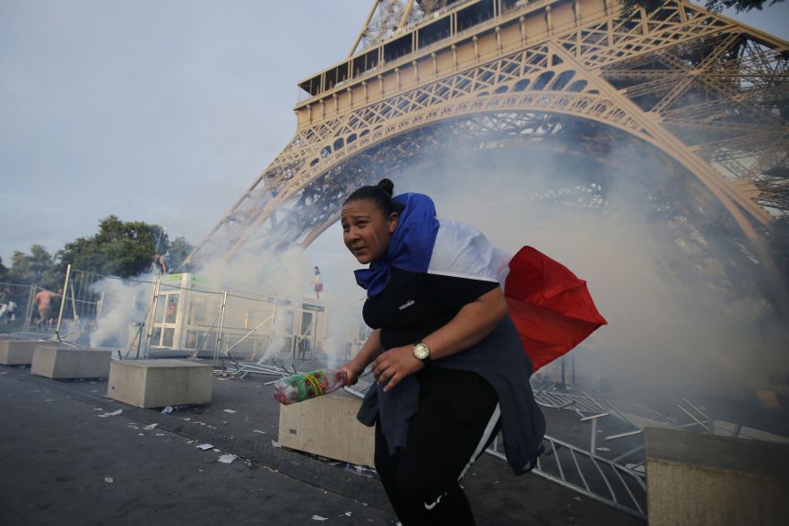 Tear gas floats in the air near the Eiffel Tower near the Paris fans zone before the start of the Portugal v France EURO 2016 final soccer match, at the Eiffel Tower in Paris, France, July 10, 2016. French police fired tear gas to disperse dozens of people trying to enter the 