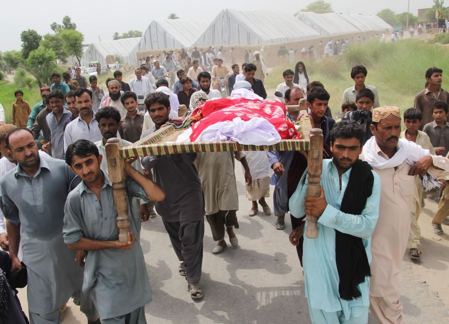 Pakistani relatives and residents carry the coffin of social media celebrity, Qandeel Baloch during her funeral in Shah Sadar Din village, around 130 kilometers from Multan on July 17, 2016. The brother of a controversial Pakistani social media star has been arrested for her murder, confessing he strangled Qandeel Baloch for 