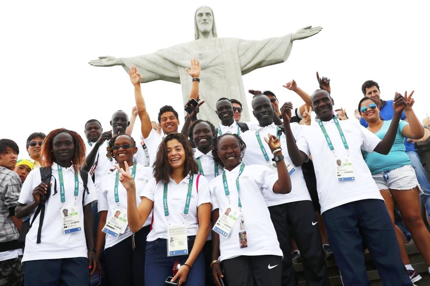 2016 Rio Olympics - Christ the Redeemer - 30/07/2016. Members of the Olympic refugee team including Yusra Mardini  from Syria (C) pose in front of Christ the Redeemer.   REUTERS/Kai Pfaffenbach  TPX IMAGES OF THE DAY