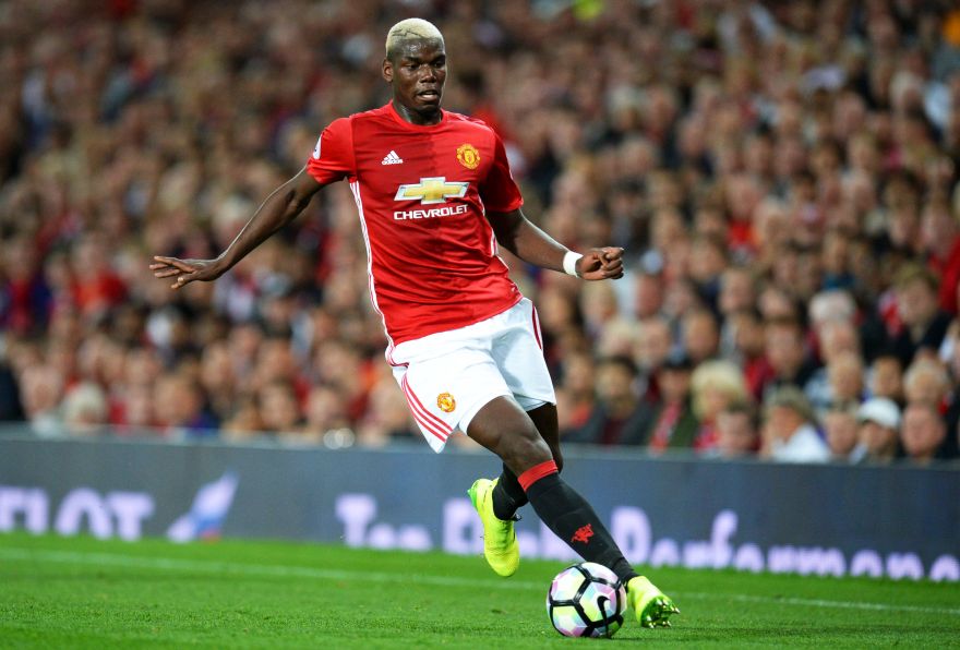 Manchester United's French midfielder Paul Pogba runs with the ball during the English Premier League football match between Manchester United and Southampton at Old Trafford in Manchester, north west England, on August 19, 2016. RESTRICTED TO EDITORIAL USE. No use with unauthorized audio, video, data, fixture lists, club/league logos or 'live' services. Online in-match use limited to 75 images, no video emulation. No use in betting, games or single club/league/player publications.  / AFP / Oli SCARFF / RESTRICTED TO EDITORIAL USE. No use with unauthorized audio, video, data, fixture lists, club/league logos or 'live' services. Online in-match use limited to 75 images, no video emulation. No use in betting, games or single club/league/player publications.