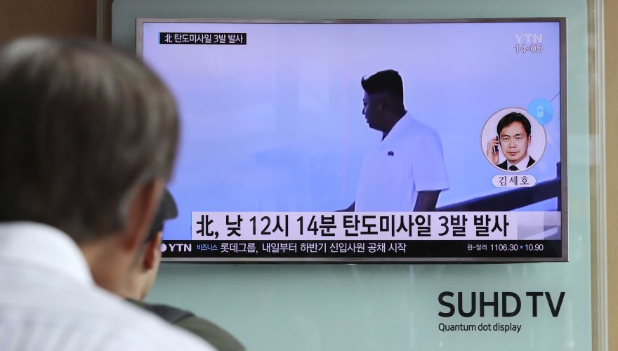 A man watches a TV news program showing a file image of North Korean leader Kim Jong Un while reporting about the North's missile launch, at the Seoul Train Station in Seoul, South Korea, Monday, Sept. 5, 2016. North Korea fired three ballistic missiles off its east coast Monday, South Korea's military said, in a show of force timed to the G-20 economic summit in China. The letters on the screen read: 