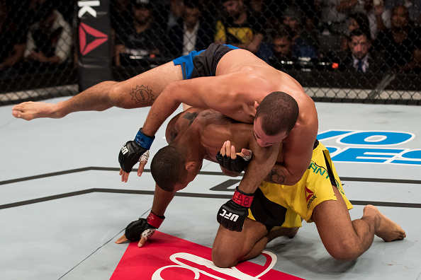 BRASILIA, BRAZIL - SEPTEMBER 24: Eric Spicely of the United States controls the body of Thiago Santos of Brazil in their middleweight bout during the UFC Fight Night event at Nilson Nelson gymnasium on September 24, 2016 in Brasilia, Brazil. (Photo by Buda Mendes/Zuffa LLC/Zuffa LLC via Getty Images)