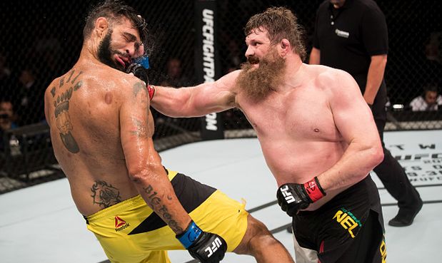 BRASILIA, BRAZIL - SEPTEMBER 24: Roy Nelson of the United States punches Antonio Silva of Brazil in their heavyweight UFC bout during the UFC Fight Night event at Nilson Nelson gymnasium on September 24, 2016 in Brasilia, Brazil. (Photo by Buda Mendes/Zuffa LLC/Zuffa LLC via Getty Images)