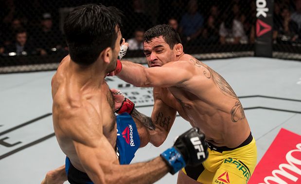 BRASILIA, BRAZIL - SEPTEMBER 24: Renan Barao of Brazil punches Phillipe Nover of the United States in their flyyweight UFC bout during the UFC Fight Night event at Nilson Nelson gymnasium on September 24, 2016 in Brasilia, Brazil. (Photo by Buda Mendes/Zuffa LLC/Zuffa LLC via Getty Images)