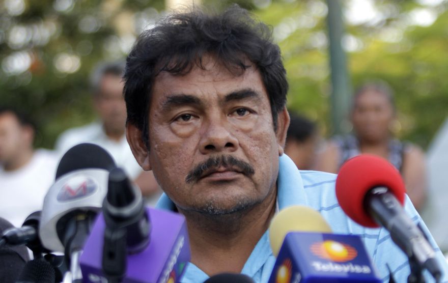 Teacher Felipe de la Cruz speaks during a press conference offered along relatives of the 43 missing students at Ayotzinapa school in Tixtla, Guerrero state, Mexico, on November 7, 2014. Suspected gang members in Mexico confessed to killing more than 40 missing students and incinerating their remains in a grisly case that shocked the country and triggered angry protests, authorities said Friday. Facing the biggest crisis of his administration, President Enrique Pena Nieto vowed to hunt down all those responsible for the 
