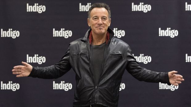 Bruce Springsteen greets fans in a  book store as he promotes his new book 