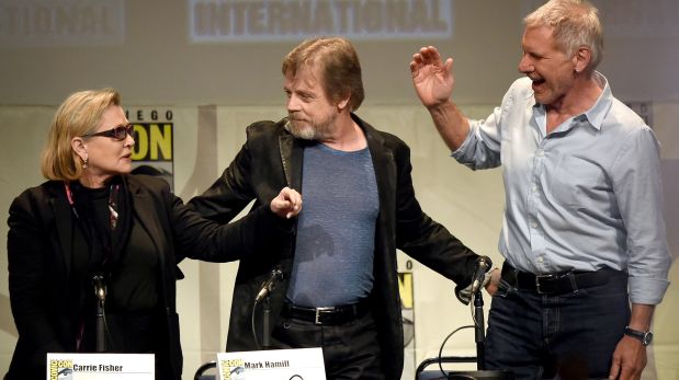 (FILES) This file photo taken on July 10, 2015 shows actors Carrie Fisher, Mark Hamill and Harrison Ford pose onstage at the Lucasfilm panel during Comic-Con International 2015 at the San Diego Convention Center in San Diego, California.   Hollywood star Carrie Fisher -- best known for her portrayal of Princess Leia in the 