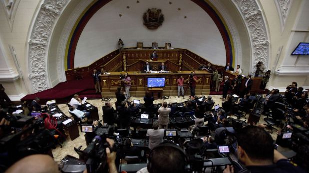 Opposition lawmakers applaud during a session at the National Assembly in Caracas, Venezuela, Monday, Jan. 9, 2017. The clock ran out Monday on the opposition's effort to oust President Nicolas Maduro in a recall vote and Tuesday marks the start of the last two years of Maduro's term. (AP Photo/Fernando Llano)