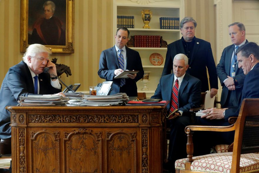 U.S. President Donald Trump (L-R), joined by Chief of Staff Reince Priebus, Vice President Mike Pence, senior advisor Steve Bannon, Communications Director Sean Spicer and National Security Advisor Michael Flynn, speaks by phone with Russia's President Vladimir Putin in the Oval Office at the White House in Washington, U.S. January 28, 2017. REUTERS/Jonathan Ernst