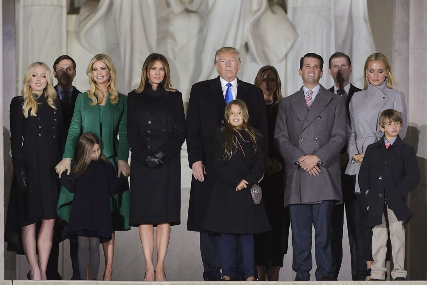 TOPSHOT - US President-elect Donald Trump and family pose at the end of a welcome celebration at the Lincoln Memorial in Washington, DC, on January 19, 2017. / AFP / MANDEL NGAN