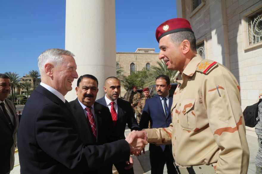 Iraqi Chief of Staff General Othman al-Ghanimi (R) welcomes U.S. Defense Secretary Jim Mattis at Ministry of Defence in Baghdad, Iraq February 20, 2017.  REUTERS/Stringer FOR EDITORIAL USE ONLY. NO RESALES. NO ARCHIVE.