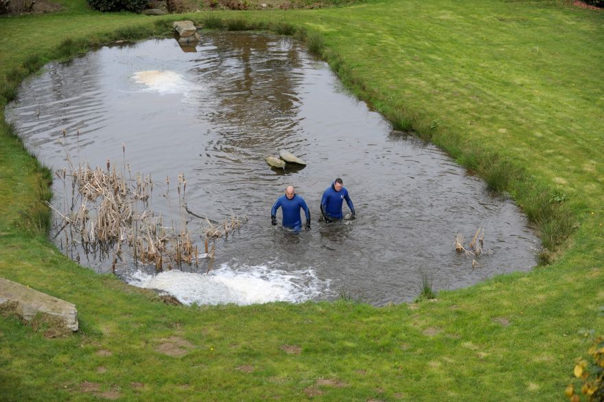 Gendarmes search in a pond ss part of the research for the Troadec family, missing since February 16, on  March 2, 2017 near Dirinon, western France.  The Troadec family -- Pascal and Brigitte, both aged 49, their son Sebastien, 21, and his sister Charlotte, 18 -- have not been seen since February 16. The mystery gripping intensified on March 1 as a jogger discovered items belonging to Charlotte Troadec a three-hour drive from where she was last seen. / AFP / FRED TANNEAU