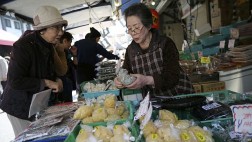 Japón prevé menor crecimiento económico tras alza de impuestos