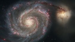 Descubren gigantescos agujeros negros que orbitan entre sí