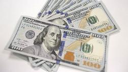 Dólar cae por menores expectativas de alza de tasa de la FED